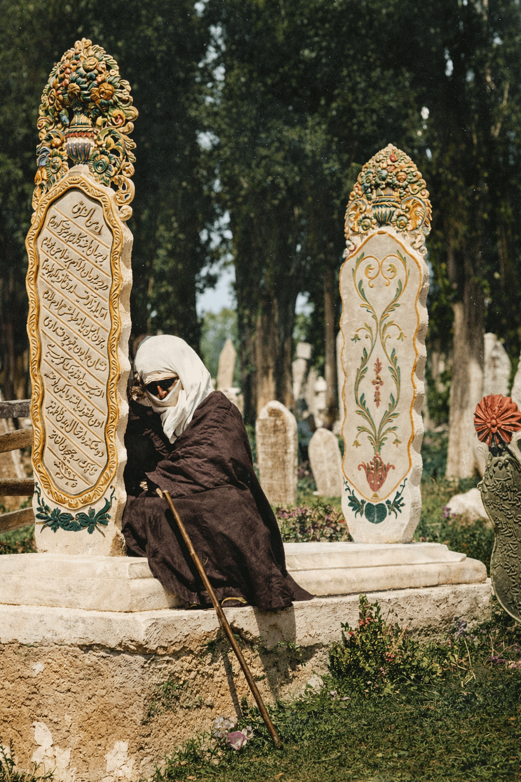 an Ottoman lady lay with her head resting on the tombstone of her daughter (İstanbul, 1880)[1024×1536]