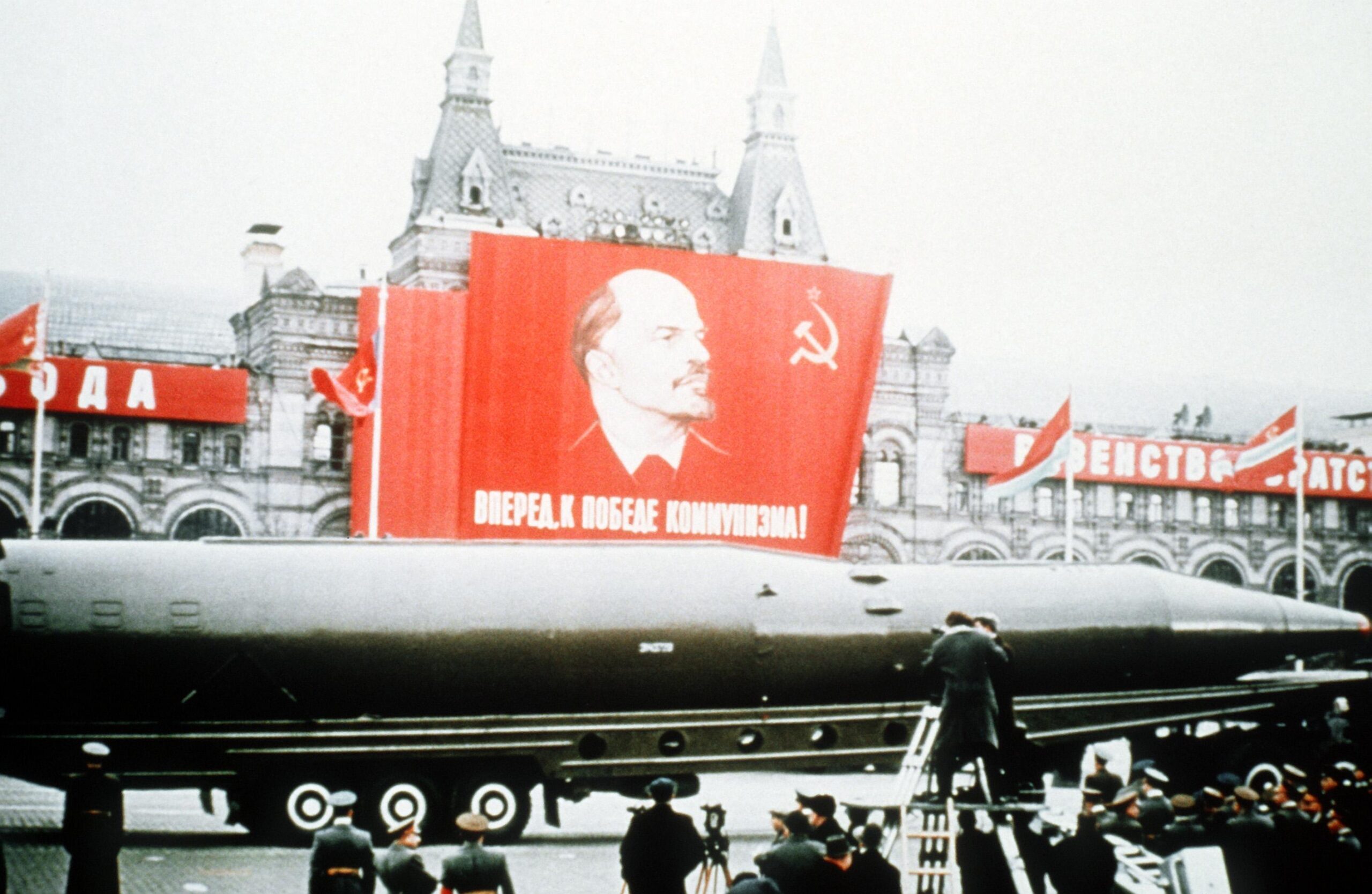 A Soviet R-26 intercontinental ballistic missile is displayed beneath a picture of Lenin in Red Square, Moscow. (1964) [2840×1850]