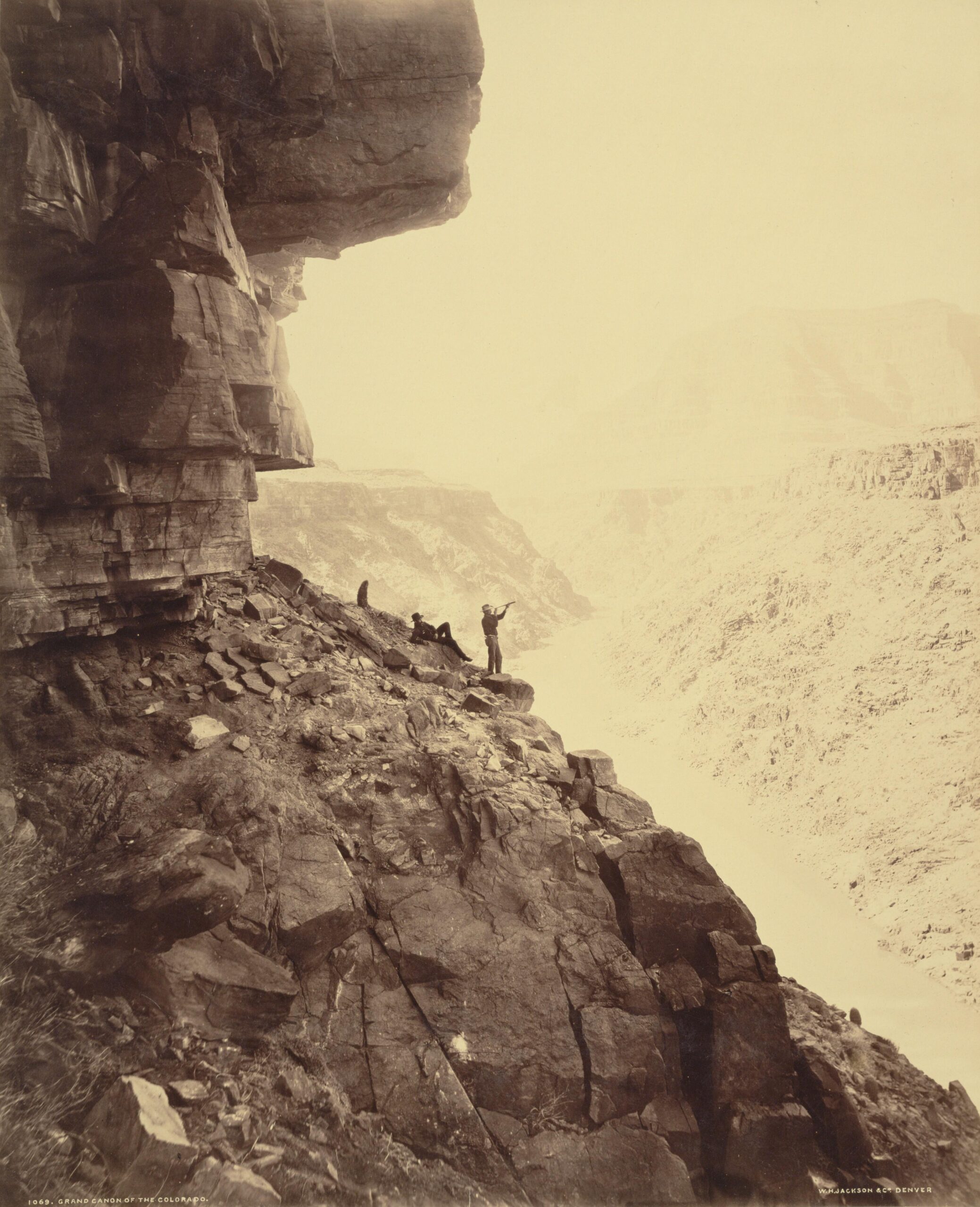 Arizona Territory.  1883.  Two men on an outcropping in the Grand Canyon.  Photographed by William Henry Jackson.  [3364 x 4145]