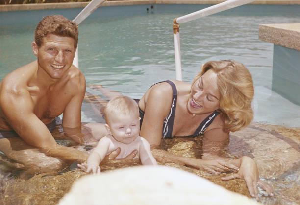 Lebanese politician Dany Chamoun (1934-1990) relaxes in a pool in Beirut, Lebanon, with his wife and daughter, 1961. [612×419]