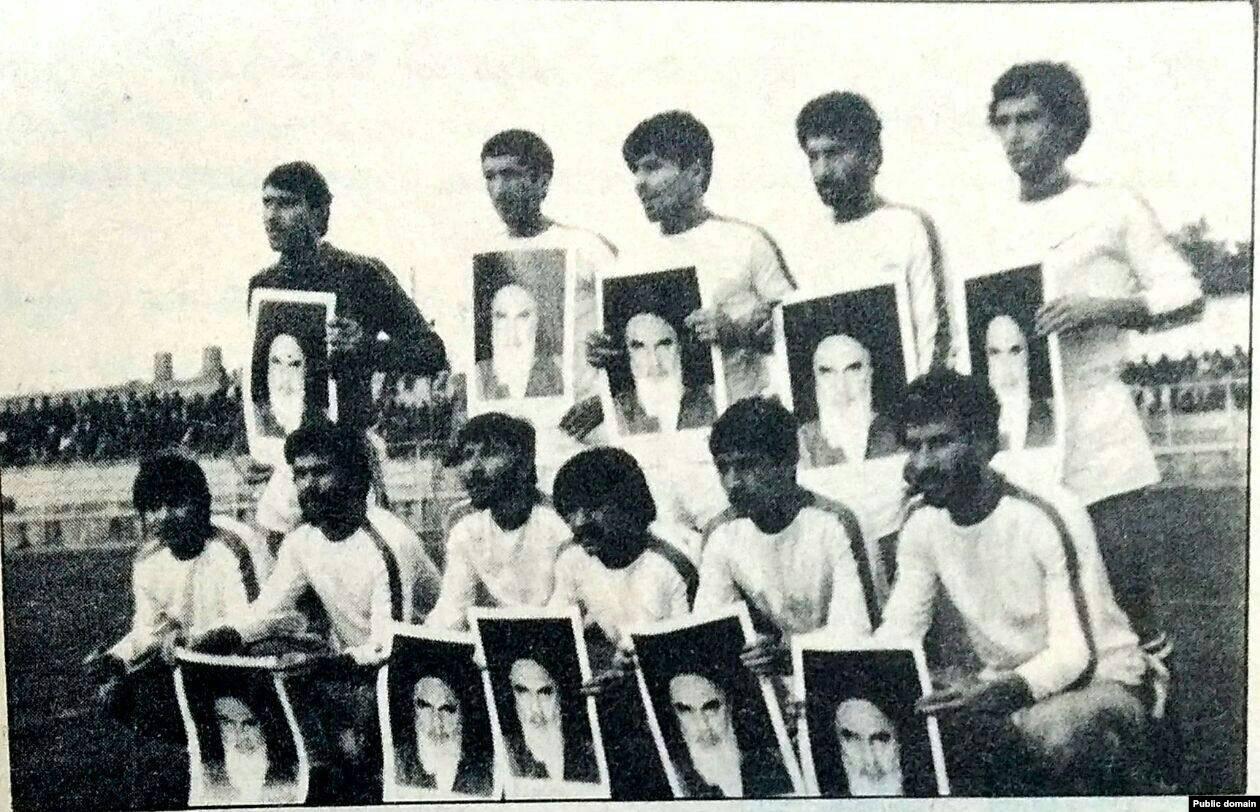 Habib Khabiri, an Iranian footballer and activist, refuses to hold a portrait of Khomeini in 1982.  [1260×812]