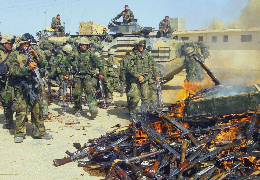 American Marines burning AKs during the Invasion of Iraq in 2003. [1080×749]