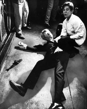 6-5-1968 Assassination of Robert F. Kennedy: Amid the immediate chaos, the crowd dispersed while 17 year old bus boy Juan Romero knelt beside the mortally wounded senator, offering comfort and placing a rosary in his hands. This poignant and heartbreaking photo came to define the tragedy. 300×379