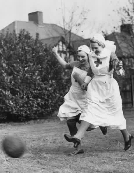 Red Cross nurses of the Mobile Unit at the Grovelands Hospital Grounds at Southgate keep fit in their spare time by organizing football games etc, World War II, UK, 1st November 1939 [461×594]
