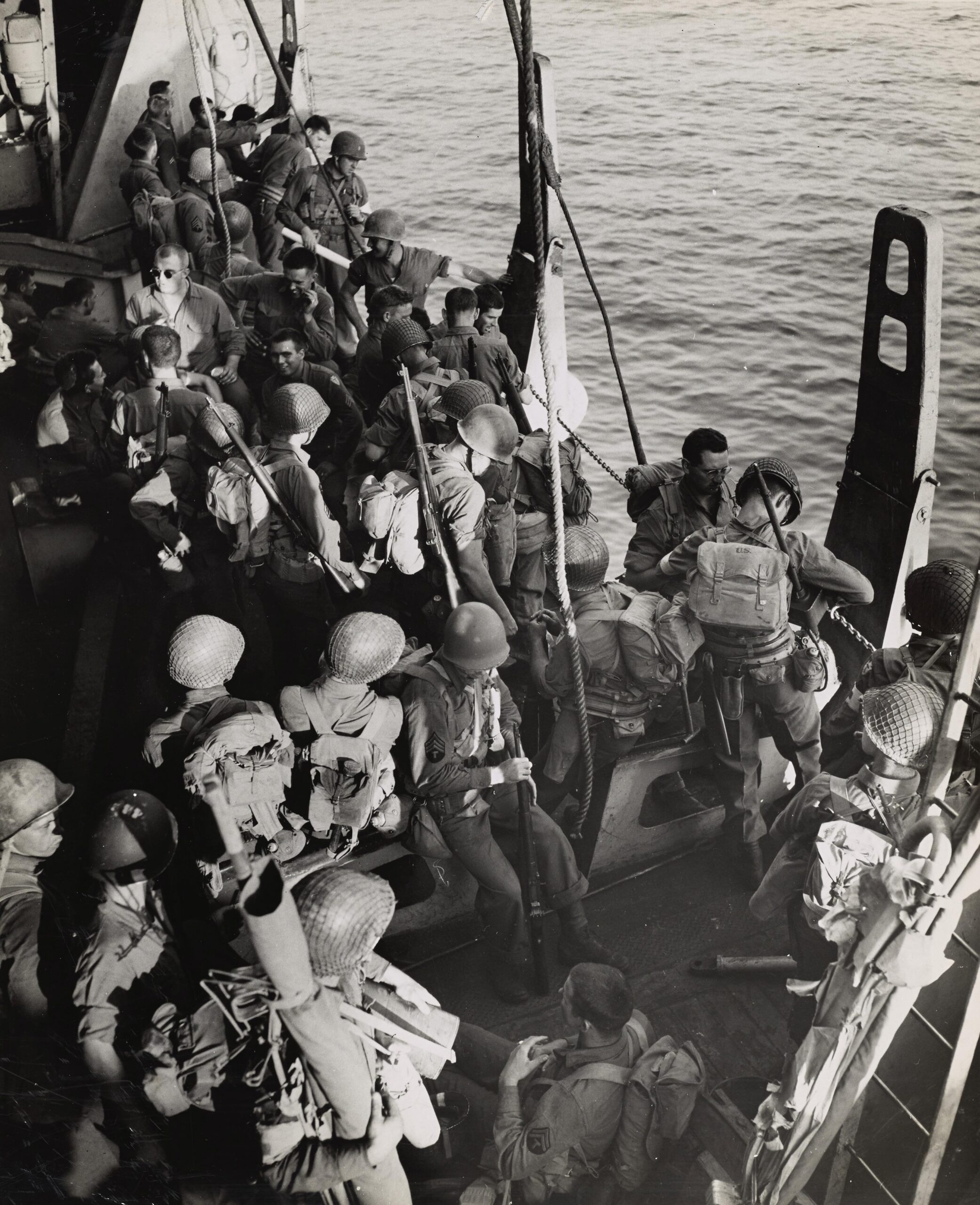 Operation Avalanche – U.S. troops board transport ships near Salerno, part of the Allied invasion of Italy. September 1942. [3495×4297]