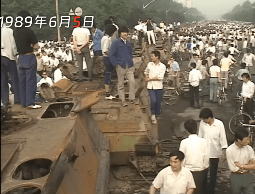 After the Tiananmen Massacre, citizens stood on top of burned-out military vehicles 5th June 1989 (855×652)