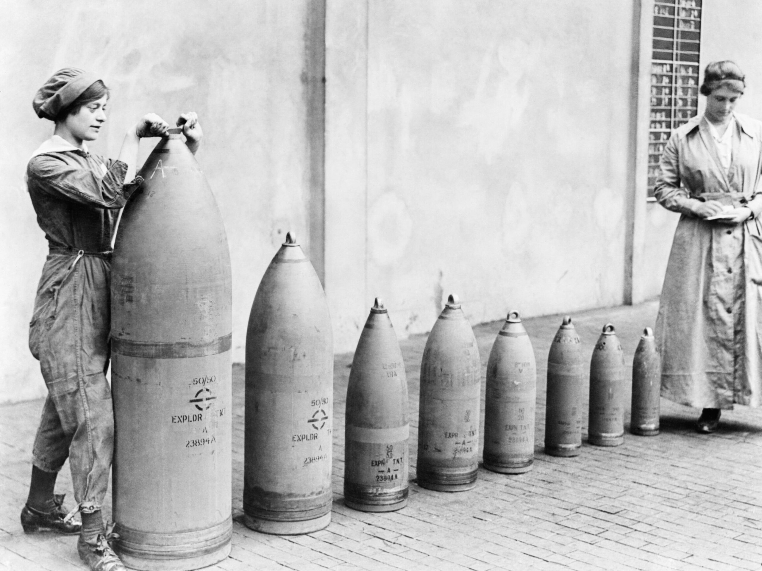 Woman working with gigantic shell in the National Shell Filling Factory No. 6 in Chilwell, Nottinghamshire, UK, 1917 [2560×1919]