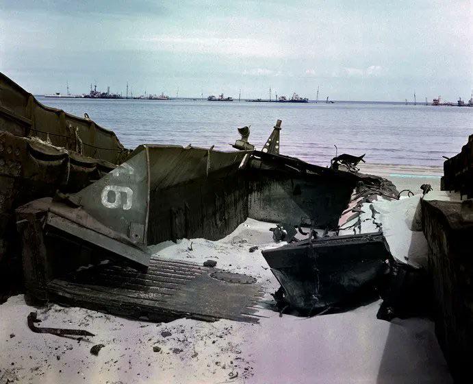 The remains of a landing craft and numerous ships (which were used as blockships), off the coast of Normandy, France, c. 1947. [691 x 560]