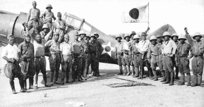Japanese personnel with a captured American Seversky P-35A fighter aircraft, from the 34th Pursuit Squadron of the USAAF – at Orani Airfield, Bataan, Philippines, c. May 1942. [800 x 419]