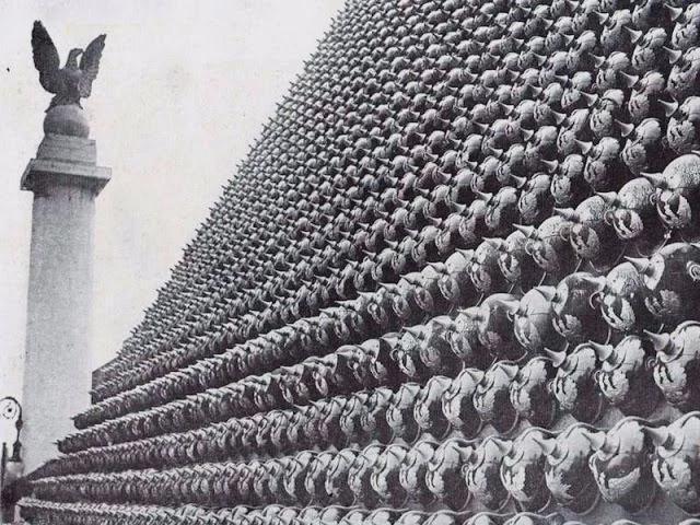 A series of German helmets displayed as a trophy in the U.S., 1918. [640×480]