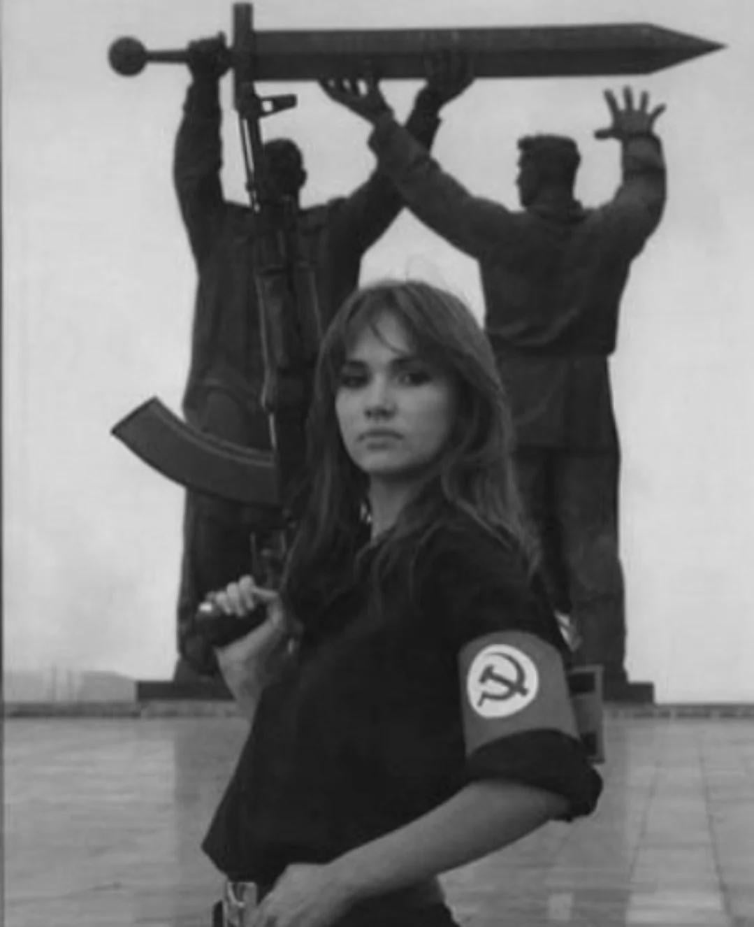National Bolshevik woman standing in front of the Home Front to Front Memorial in Magnitogorsk, Russia, 1995. [1079×1326]