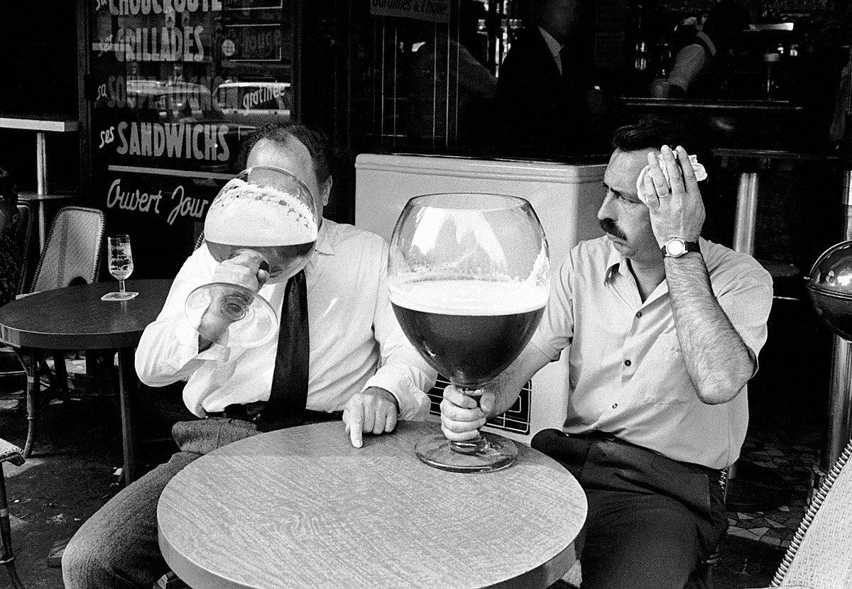 Men drink from “oversized” drinking glasses during the heatwave in Paris; Photo: Keystone Photo Agency; France – Paris, 1971 [1200×830]