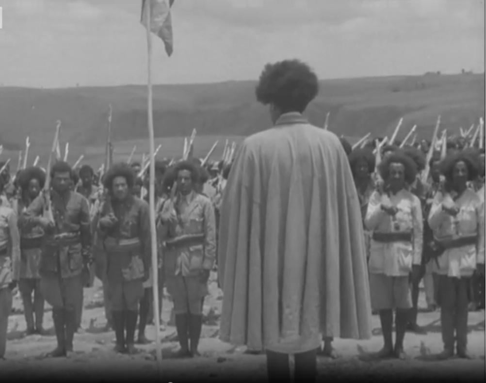Photograph of Ethiopian Partisan leader, Abebe Aregai, giving a speech to his fellow fighters, taken during the Allied liberation of Ethiopia from Fascist Italian occupation (East African Campaign, 1940-1941) [1002 × 790]