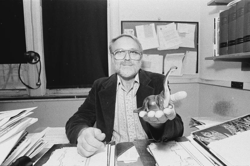Biologist and Cryptozoologist, Dr. Roy Mackal, in his University of Chicago office, 1980. Mackal contributed greatly to the study of viruses and biochemistry. He also undertook multiple expeditions in pursuit, at different times, of both the Loch Ness Monster and Africa’s Mokele Mbembe. [840 x 560]