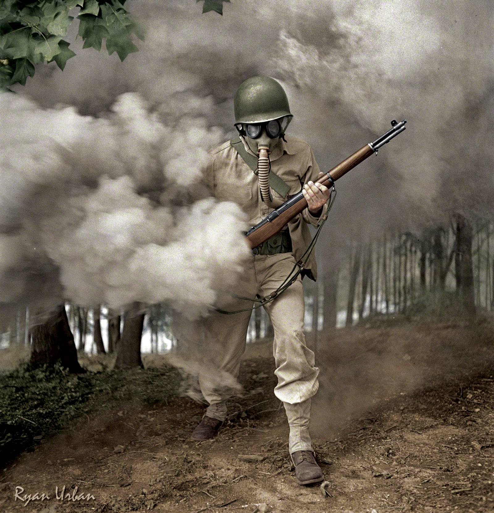 Sergeant George Camblair practicing with a gas mask in a smokescreen. Fort Belvoir, Virginia. Colorized (1942) [1600×1661]