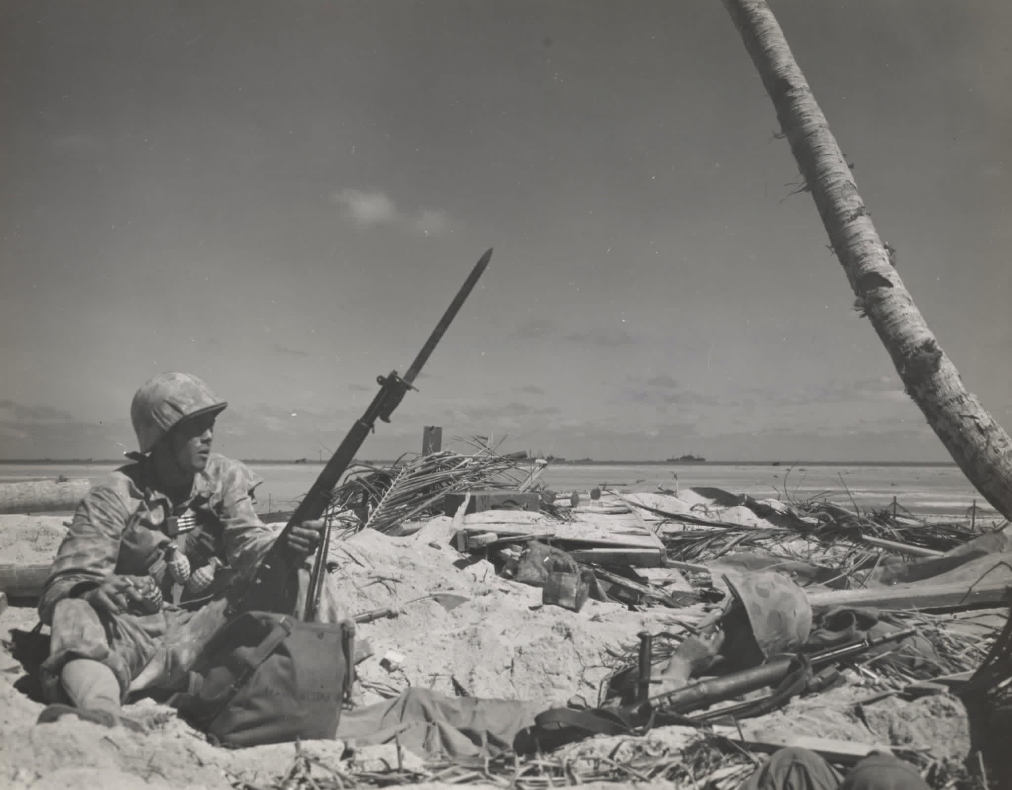 Marine awaits the order to move forward during the Battle of Tarawa, 1943 [2048×1599]