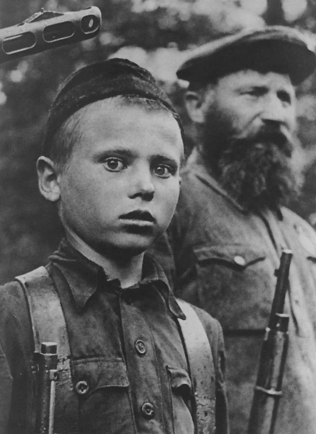 A child serving in the Soviet partisans. Photographed in Novgorod, 1942. [1034×1420]
