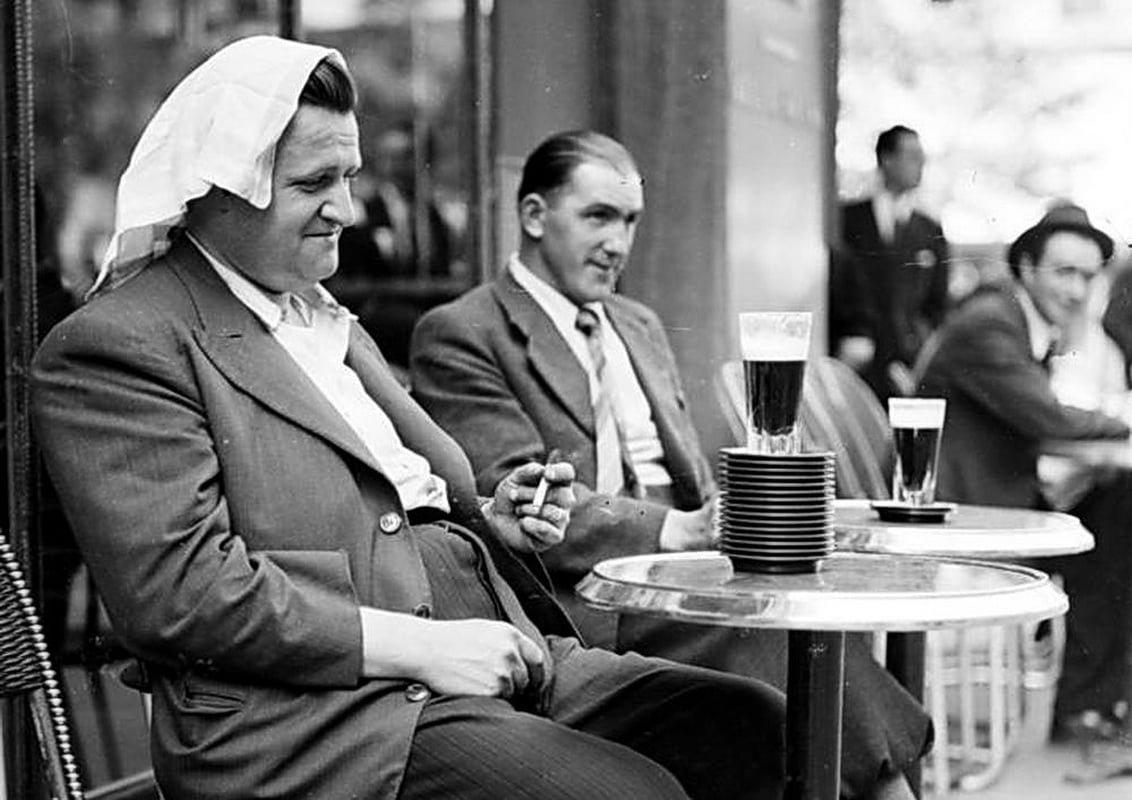 A victim of the heatwave, in front of him a pile of saucers, equivalent to his number of drinks (so far…); France – Paris, June 1941 (WW2) [1132×800]