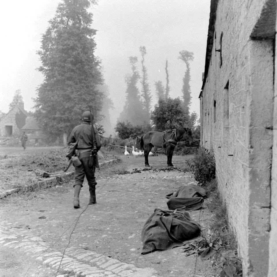 Fallen US Paratroopers await burial in Les Forges southwest of Sainte-Mère-Église in Normandy just north of the N13 and D70 intersection – June 1944. (Bob Landry Photographer LIFE Magazine Archives) [960×960]