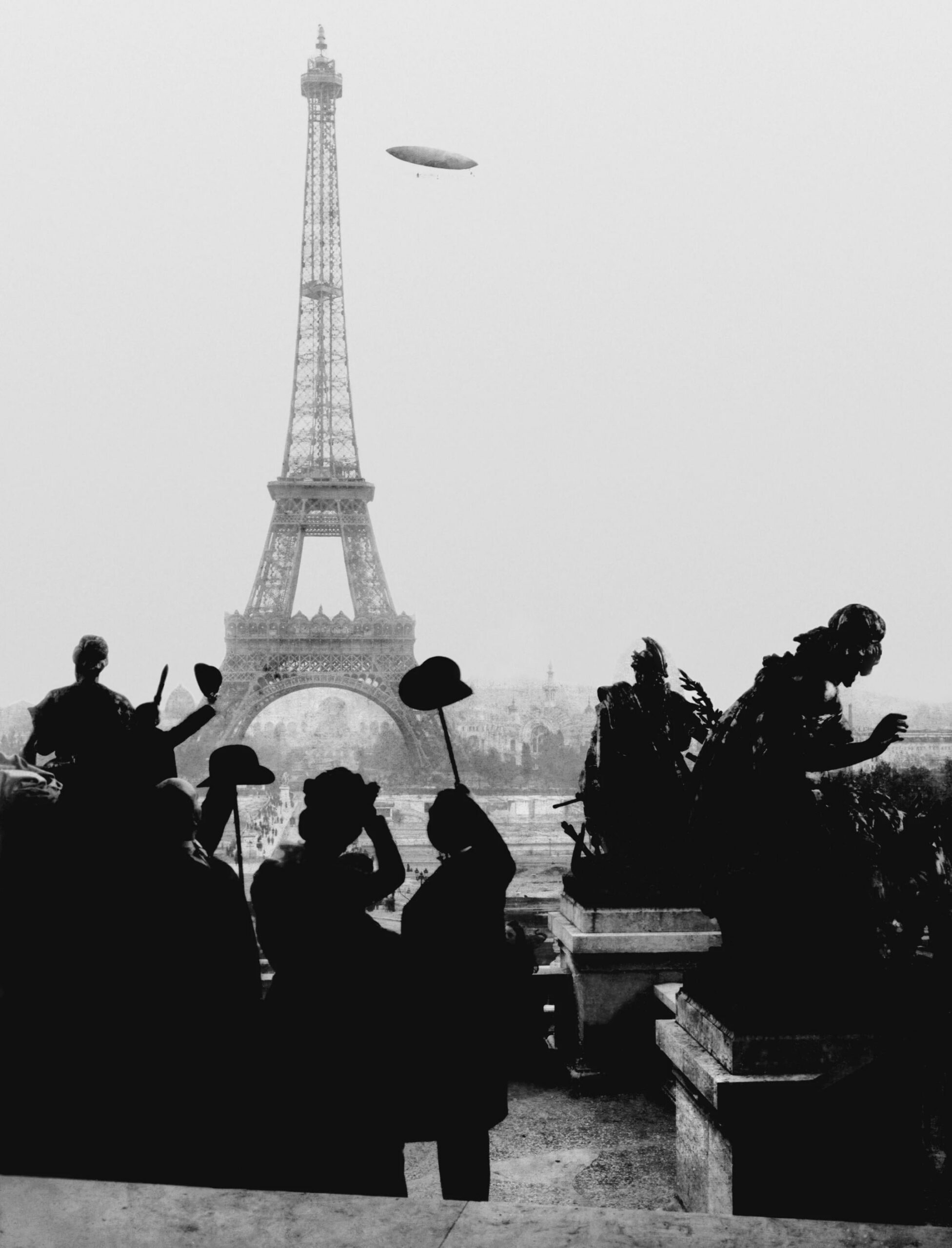 Parisians waving at the Santos-Dumont 6 airship, which won its inventor the Prêmio Deutsch award for travelling from Parc Saint Cloud to the Eiffel Tower and back in under 30 minutes. (1901) [2143×2811]