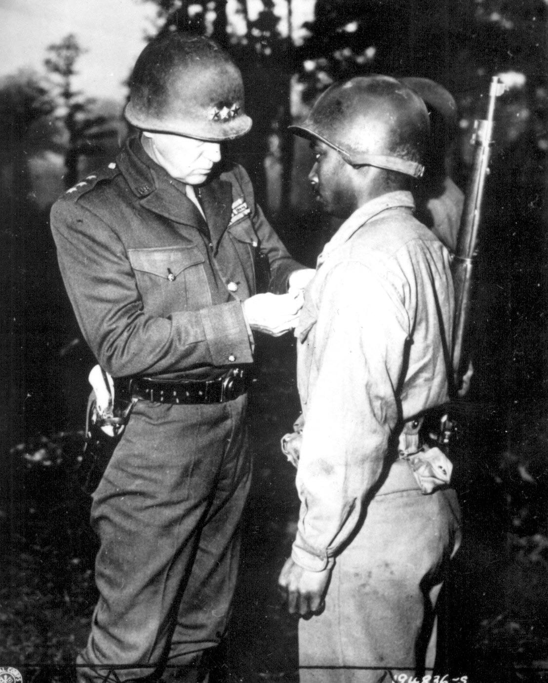 Lt. Gen. George S. Patton pins the Silver Star on Private Ernest A. Jenkins of New York City for his conspicuous gallantry in the liberation of Chateaudun, France…” October 13, 1944 [1110×1383]