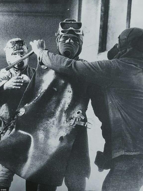 A liquidator prepares to descend onto the roof of reactor No. 3 at the Chernobyl Nuclear Power Plant to clear radioactive debris released by the explosion of reactor No. 4, April 1986. [575×767]