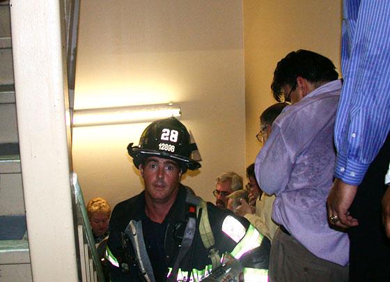 Firefighter Mike Kehoe ascending the stairs of Tower One, 2001[560×405]