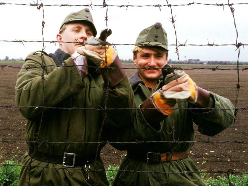 Members of the Hungarian Border Guard – as they had begun to dismantle the SZ-100 electric warning system at the border with Austria, c. May 2nd, 1989. [818 x 614]