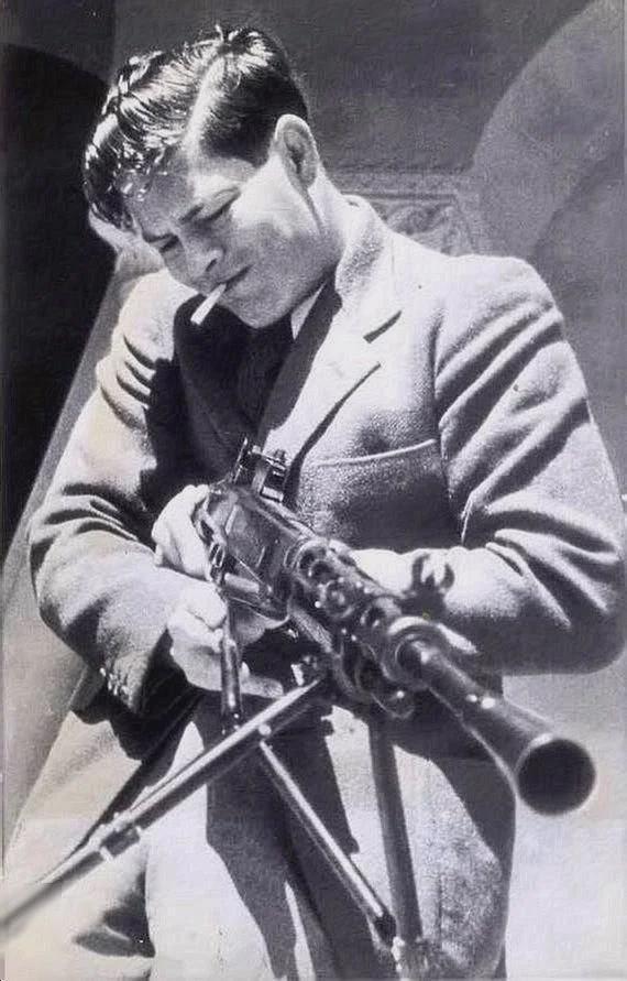 King Michael of Romania smoking a cig and playing with a soviet machine gun in Sevastopol, 1942. [570×891]