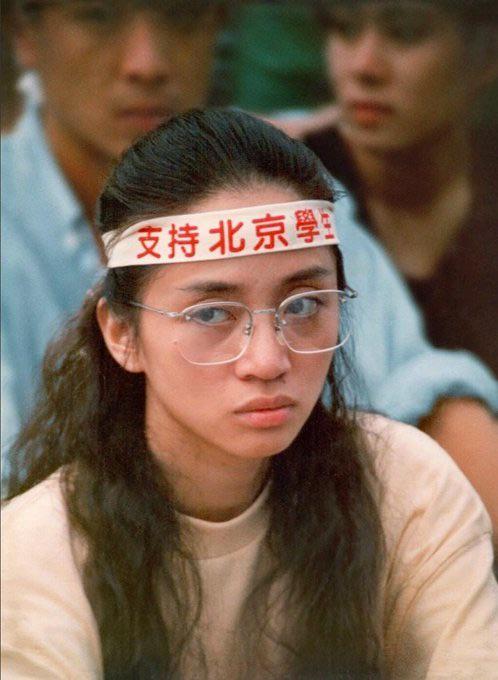 Anita Mui Yim-fong, wearing a headband that said “Support Beijing Students” – in support of the Tiananmen protests – at Hennessy Road, Wan Chai – in the British Overseas Territory of Hong Kong, on May 21st, 1989. [498 x 680]