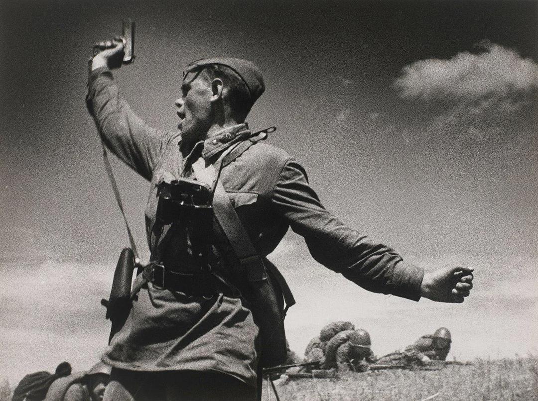 “Kombat” is a heroic photograph of the Soviet political commissar of the 220th Infantry Regiment urging his soldiers to attack on the Eastern Front in Soviet Ukraine, July 12, 1942. The man in the photograph is said to have died minutes after it was taken. [1280×956]