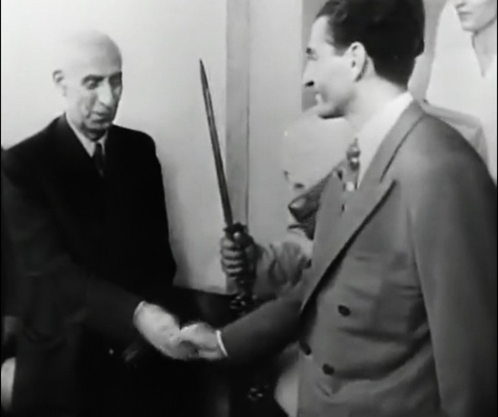 The Shah greets his Prime Minister, Mohammad Mosaddegh, having accepted his Parliamentary nomination to the position. Iran, 1951 [1004×841]