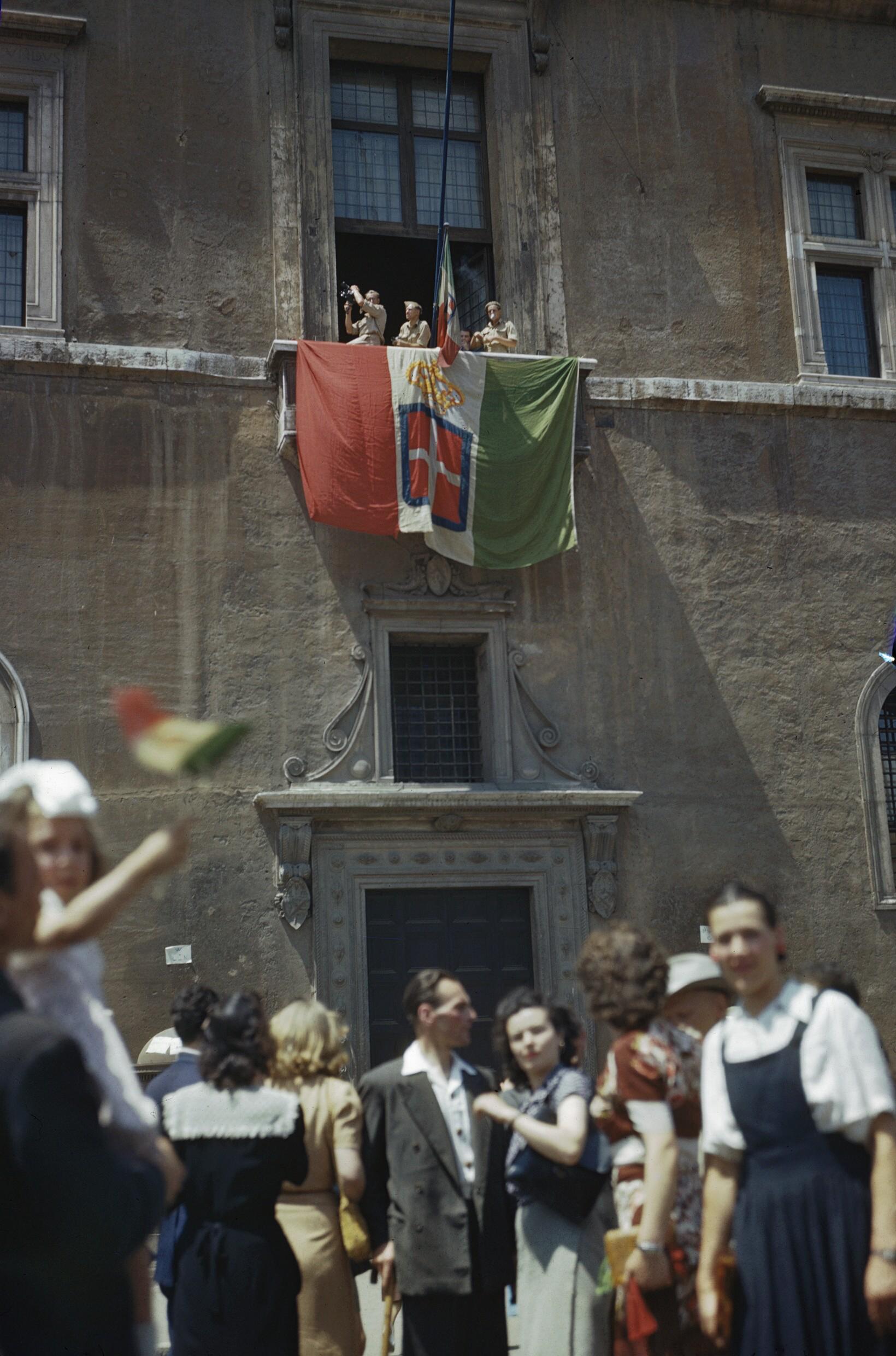Italian flag displayed by Allies from where Mussolini used to speak, the balcony of the Venice Palace, after the liberation of Rome. 5 June 1944 [1080 x 1633].