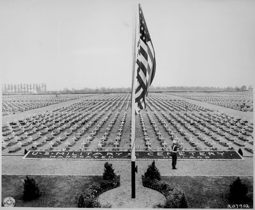 A bugler blows taps at the close of Memorial Day service at the American Military Cemetery, Margraten, The Netherlands, where lie thousands of American heroes of World War II. April 30, 1945. [1080×889]
