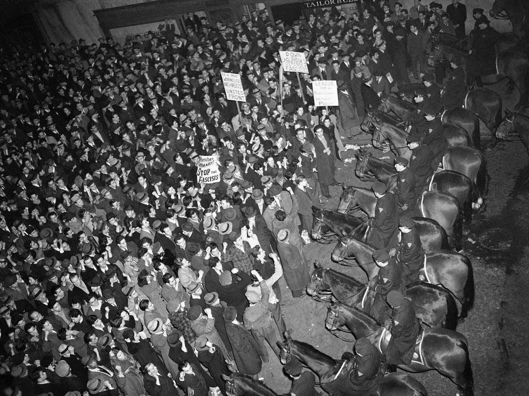 Thousands of anti-fascist protestors confronting the NYPD at Madison Square Garden in NYC where a Nazi rally was being held, 1939 [640 x 480]