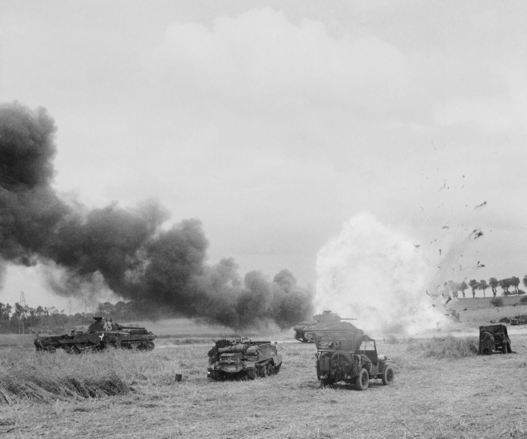 An ammunition lorry of the British Army’s 11th Armoured Division explodes after being hit by mortar fire during Operation Epsom. Normandy, France, 26 June 1944 [1705 × 1420]