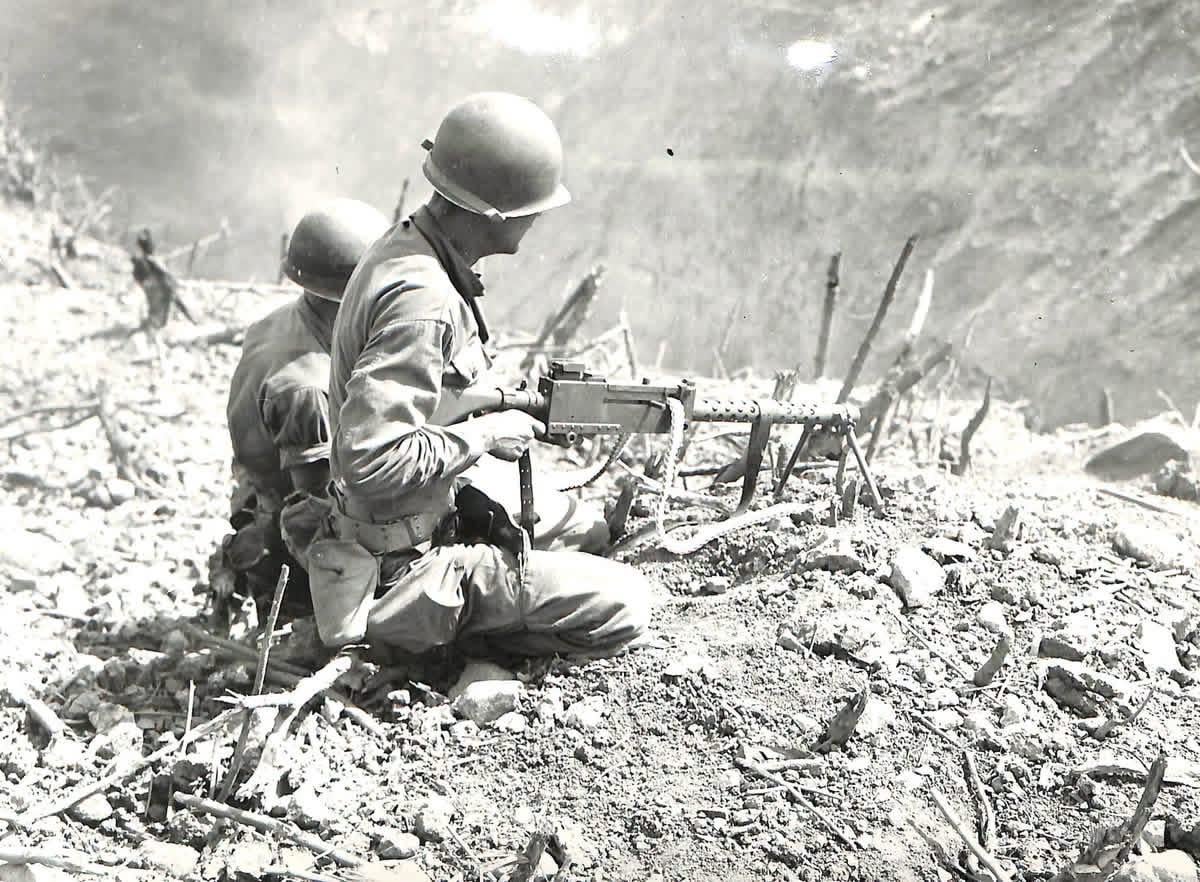 U.S. soldiers man a machine gun from a rubble-covered position during operations against the fortified islands guarding Manila Bay, 1944 [1200×882]