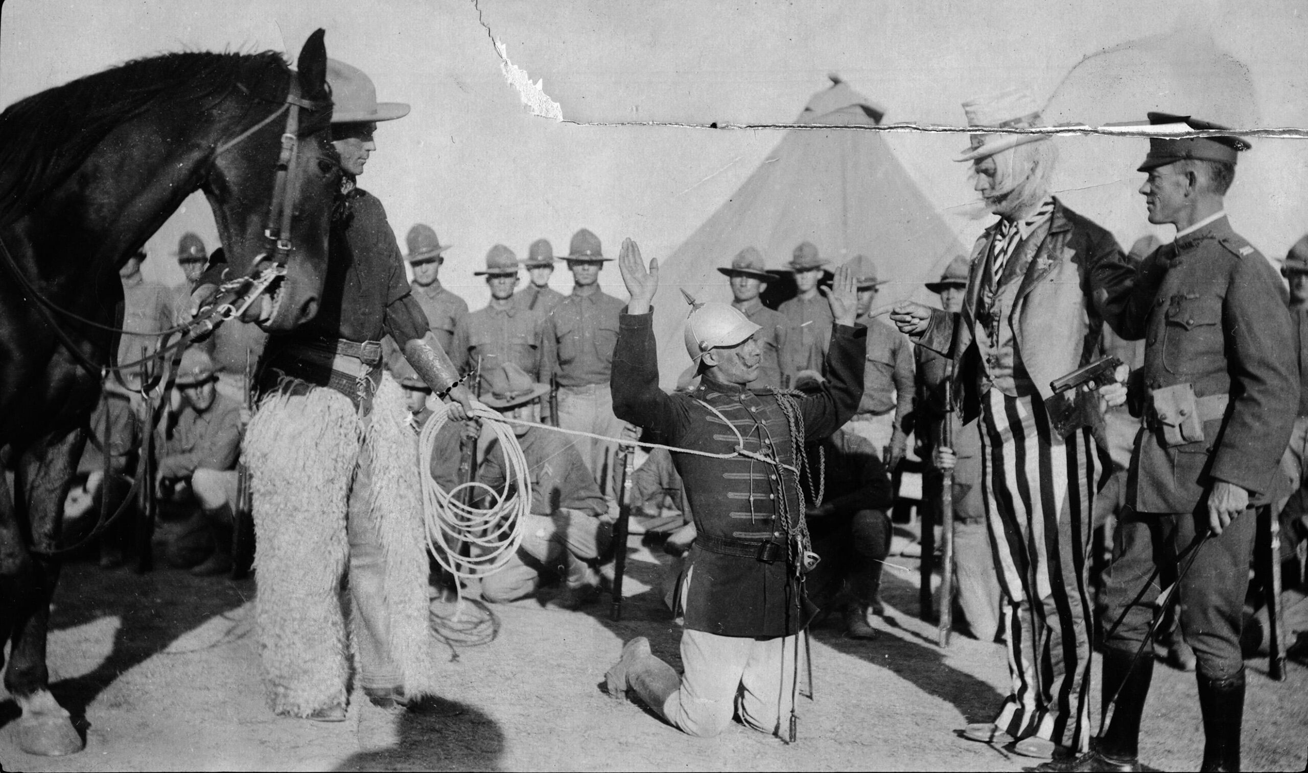 American soldiers in costume acting out the defeat of the German Kaiser by Uncle Sam, 1917, (2640×1560)