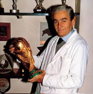 Italian Sculptor Silvio Gazzaniga holding the FIFA World Cup which he sculpted in 1974 [300 x 303]
