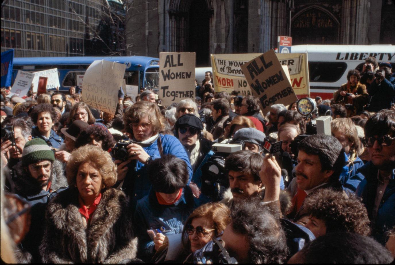 Demonstrators participating in a National Organization for Women (N.O.W.) rally outside St. Patrick’s Cathedral in New York City to show solidarity and support for women’s rights in Iran following the Iranian Islamic Revolution. (1979) [1375×922]