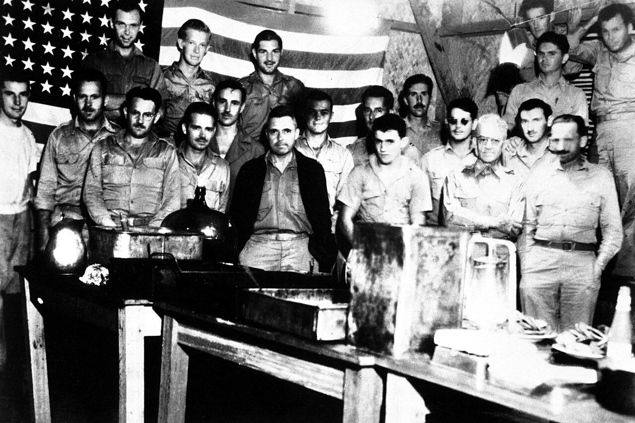 American prisoners of war celebrate the 4th of July, 1942 in the Japanese prison camp of Casisange in Malaybalay, on Mindanao, Philippine Islands. It was against Japanese regulations and discovery would have meant death, but the men celebrated the occasion anyway. [1280×853]