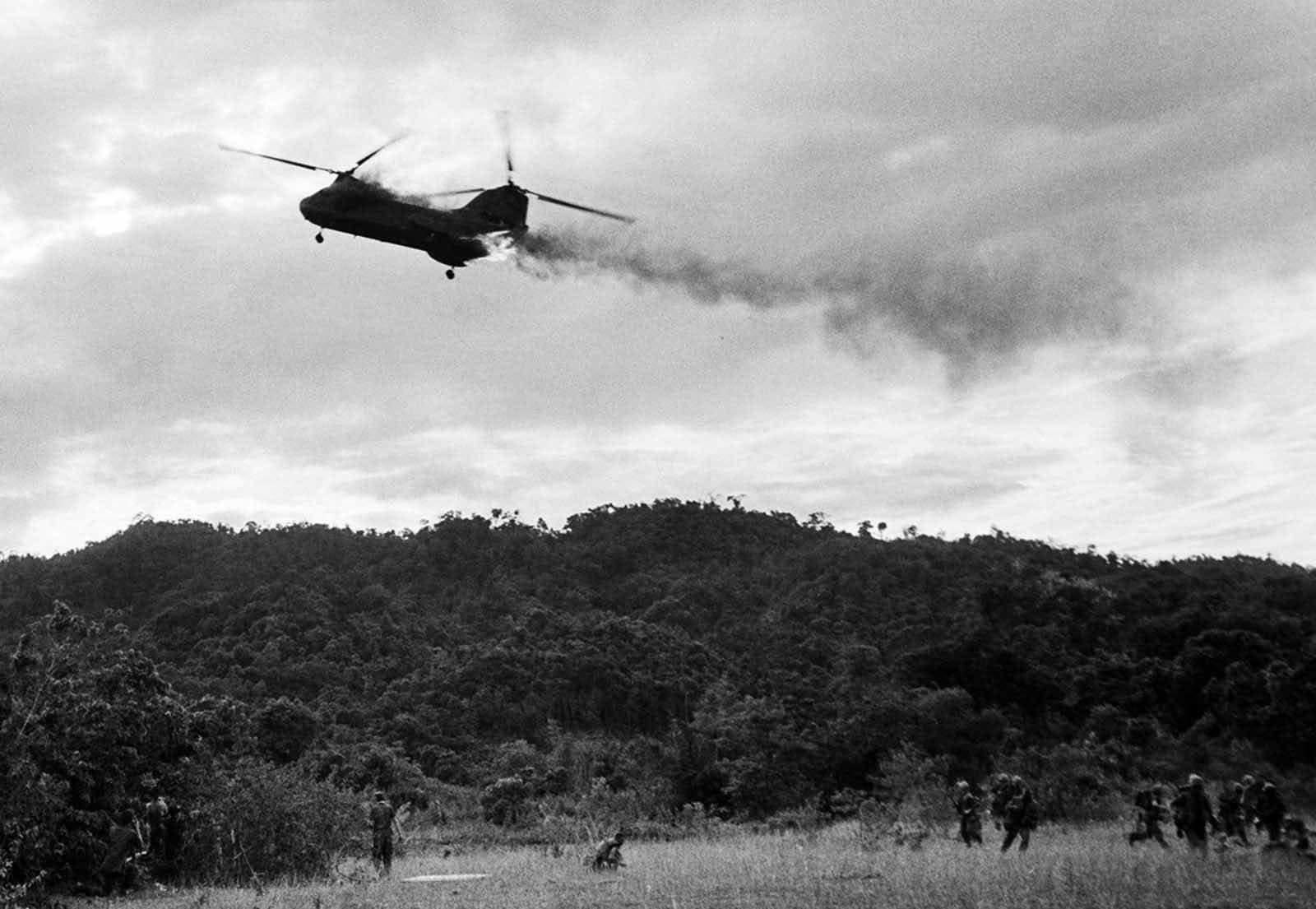 A USMC CH-46 Sea King is shot down in “Helicopter Valley” by North Vietnamese antiaircraft fire. 13 Marines were killed, July 15th, 1966 [1600 x 1105]