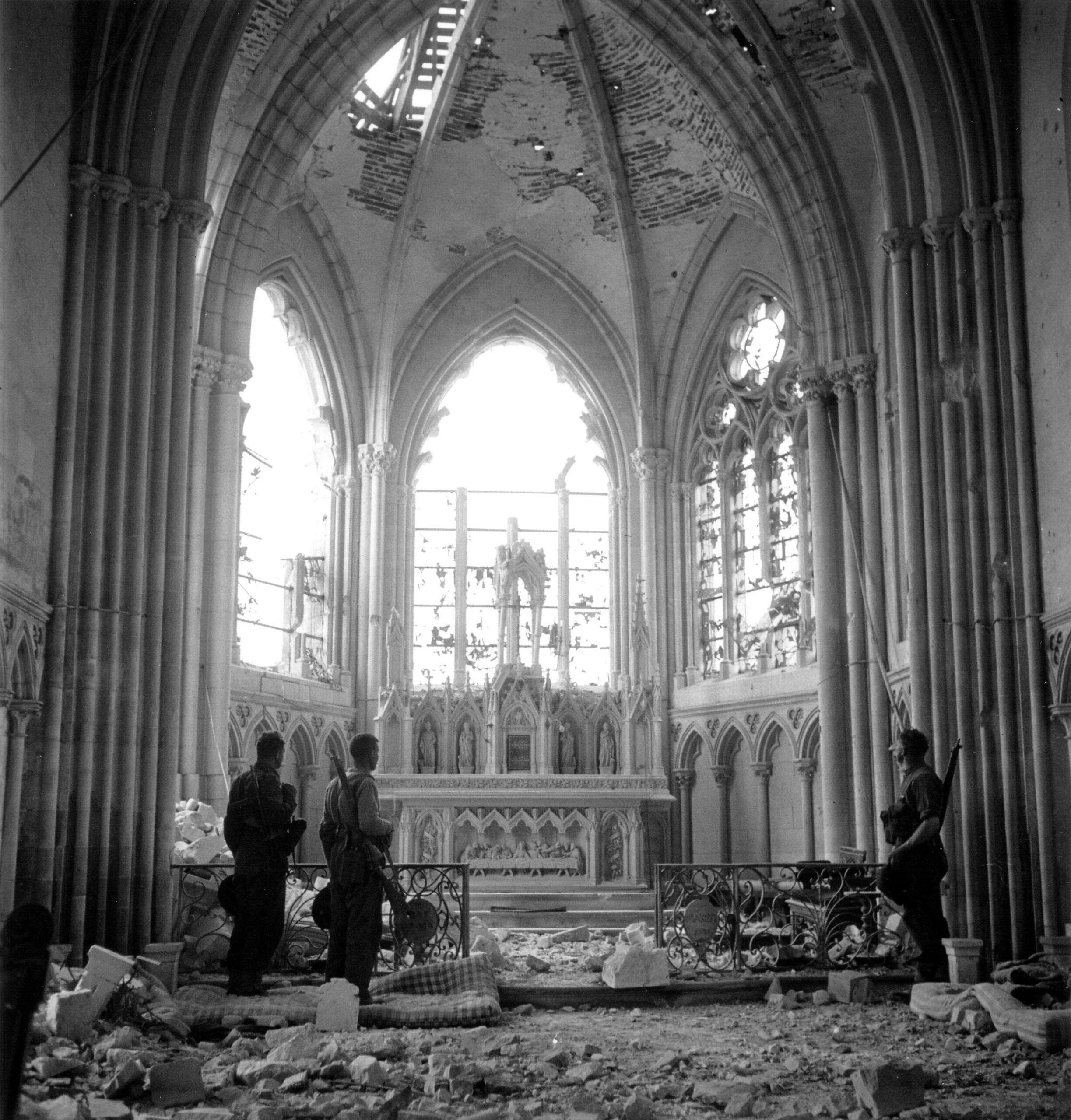 Soldiers from the 9th Canadian Infantry Brigade in a damaged church in Carpiquet, France. 12 July 1944 [2480 × 2594]