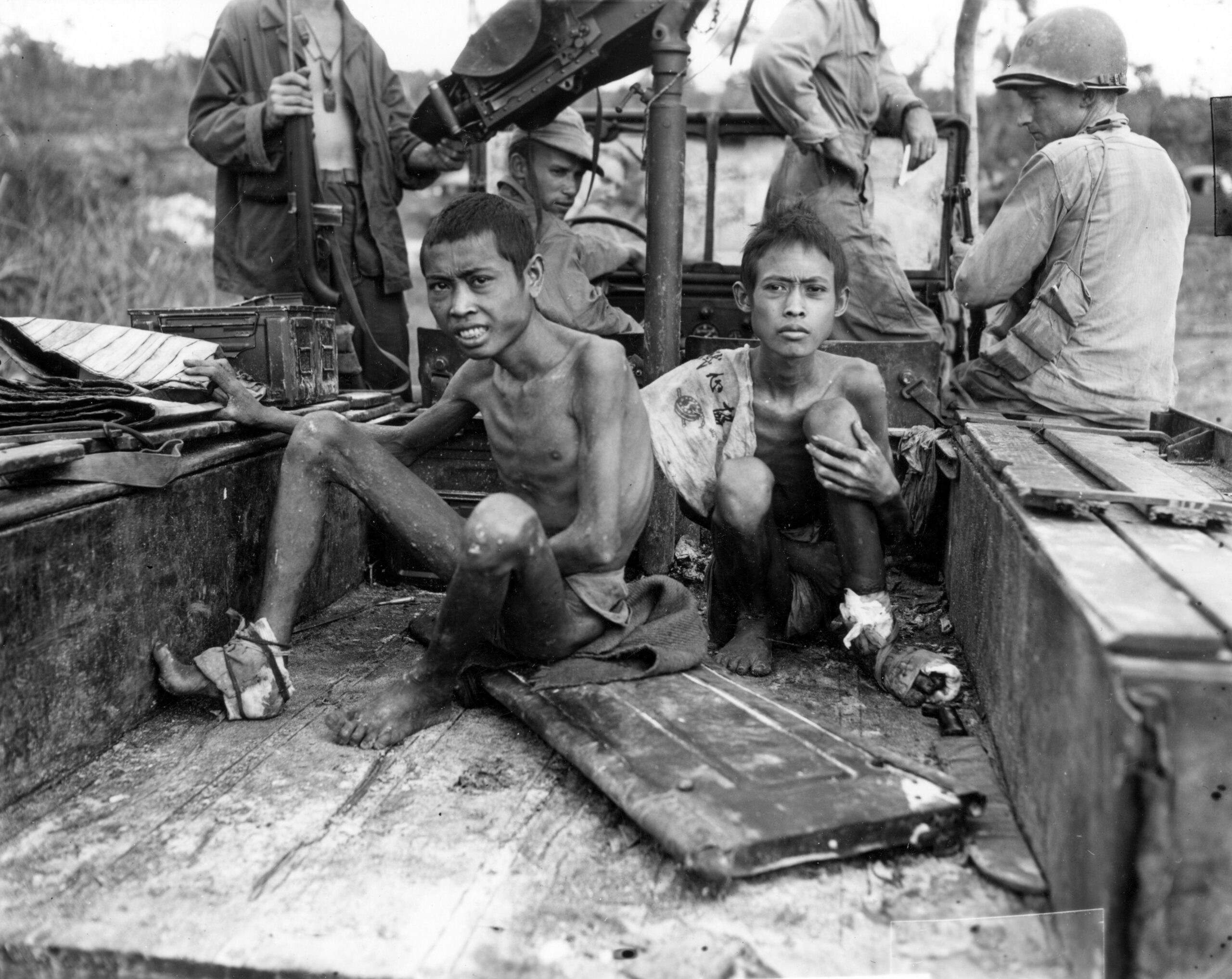 2 Javanese laborers who escaped from the Japanese and were rescued by men of the 158th Infantry Regiment. Noemfoor Island, New Guinea. 5 July, 1944 [5518 × 4382]