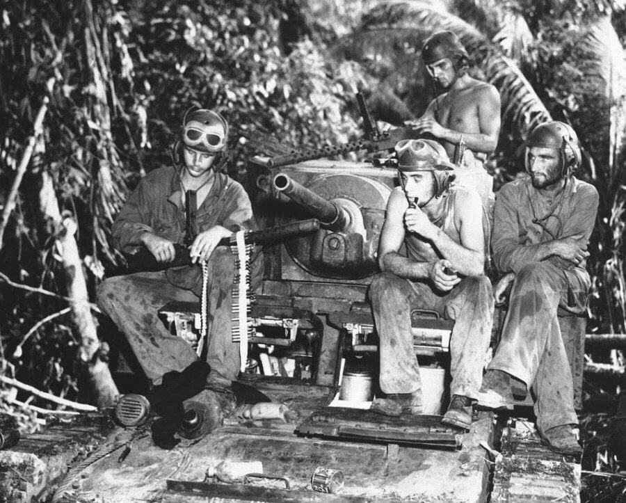After three days of non-stop fighting in the front line at the Battle of Munda Point during the New Georgia Campaign in the Pacific, a US Marine tank crew take time to rest. The tank crew is credited with wiping out 30 Japanese pill boxes during combat. July 1943 [900×723]