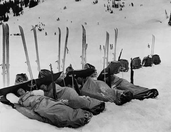 American soldiers from the 503rd Parachute Ski Battalion rest in sleeping bags on the snow after hiking and skiing across rugged mountain terrain during training exercises in February 1942 [600×462]
