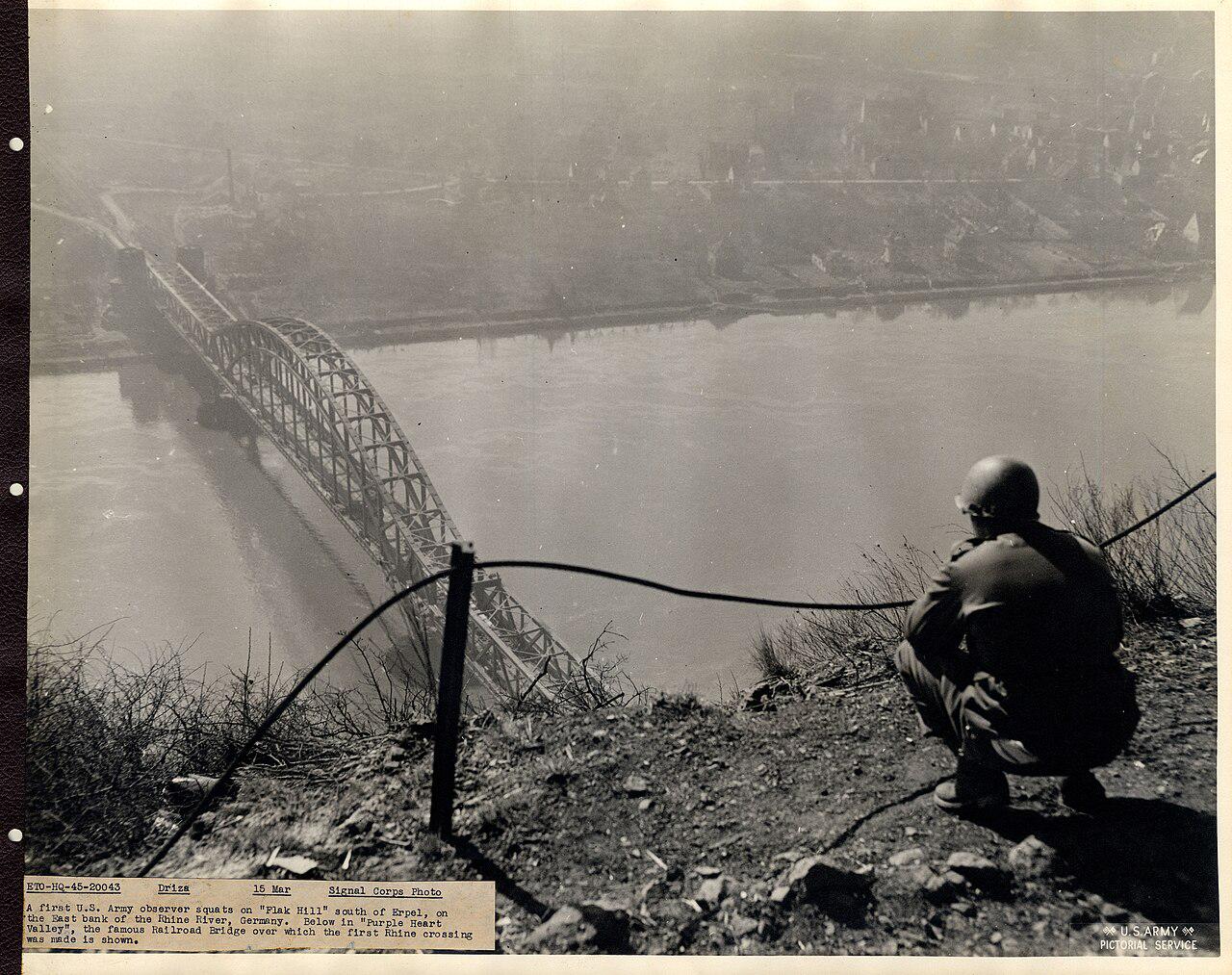 Erpel, Germany.  March 15, 1945.  An American GI surveys the Ludendorff Bridge over the Rhine, between Erpel and Remagen. [1280 x 1013]