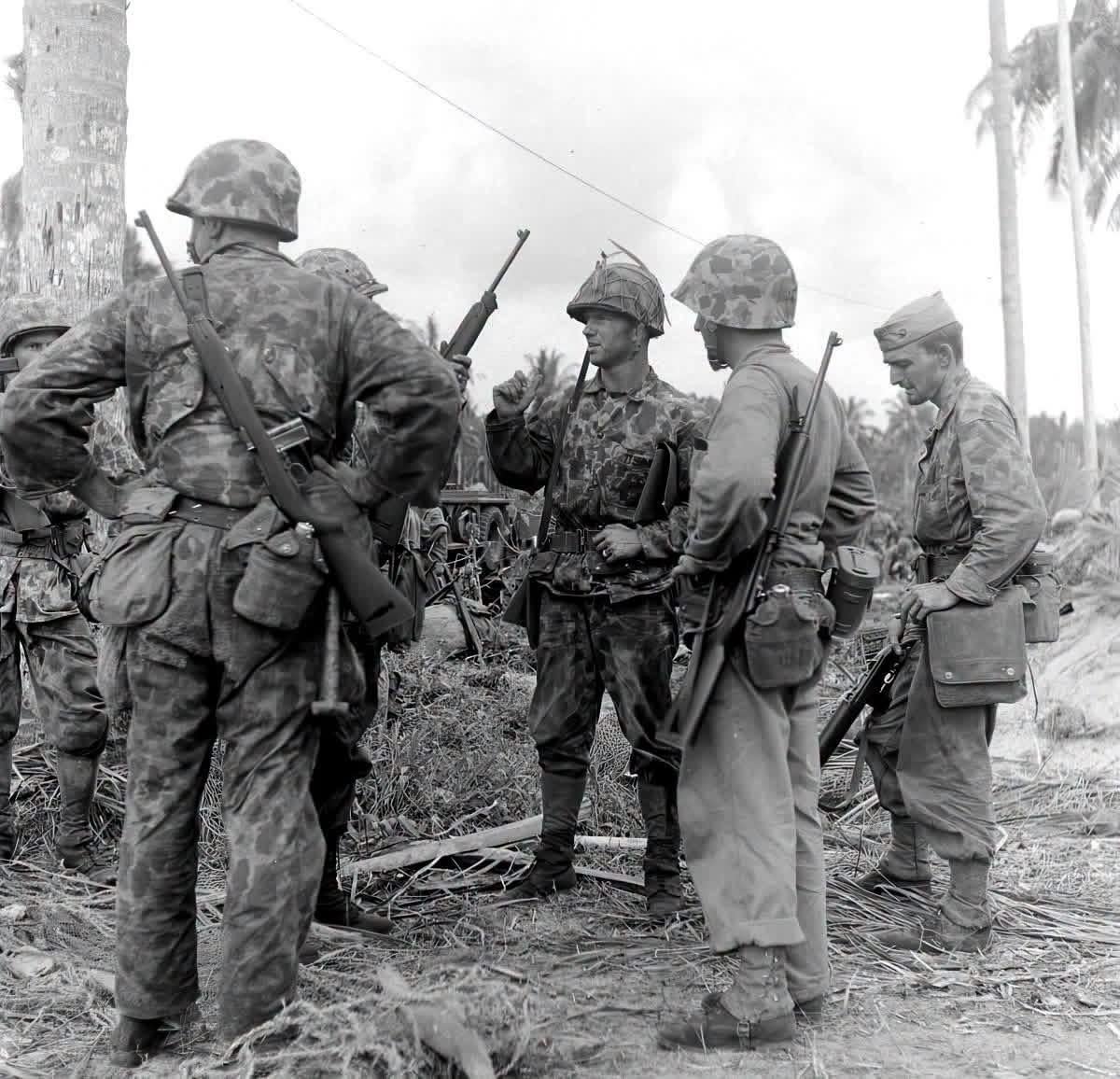 U.S. Marines discuss their next objective on Bougainville, 1943 [1200×1156]