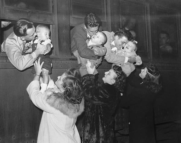 Three post-Pearl Harbor fathers saying goodbye to their children at Central Station in Detroit, Michigan, as they leave for training at Fort Custer, September 23, 1943 [600×475]