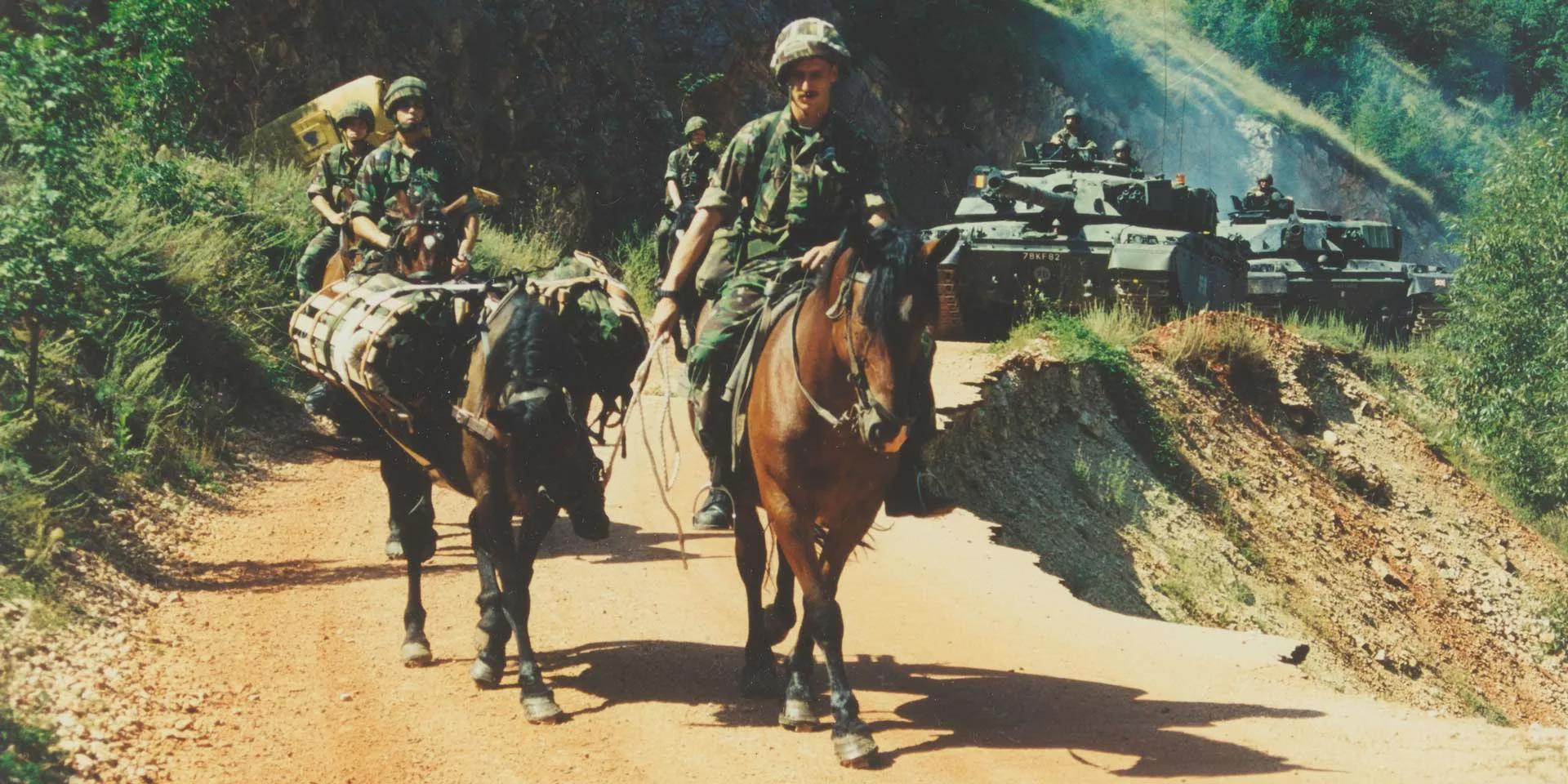 King’s Royal Hussars on mounted patrol with pack horses, alongside their Challenger 1 main battle tanks, Mrkonjic Grad area, Bosnia, 1997[1920×960]